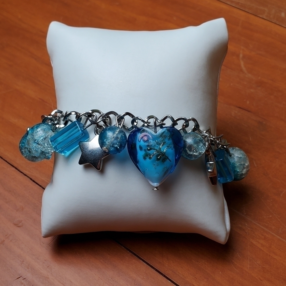 NWT bracelet, silver with blue, white, and silver charms